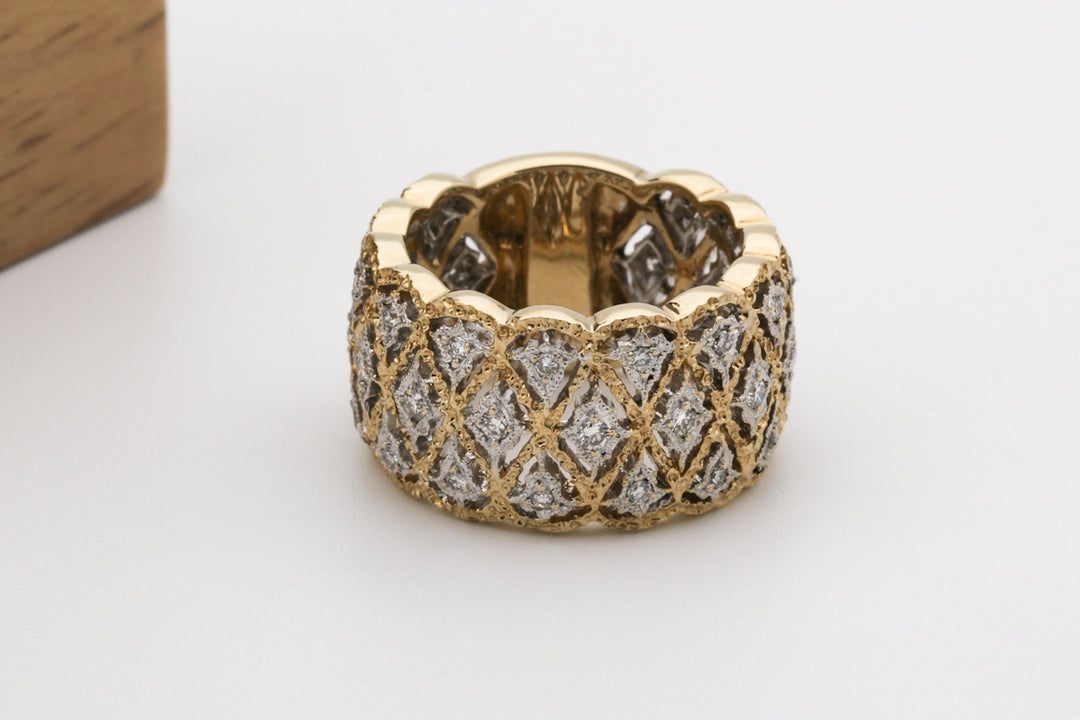 gold and silver ring on white surface