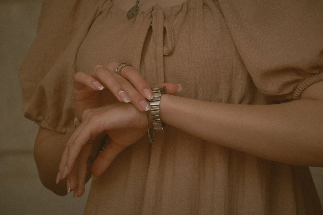 A woman checks her watch.